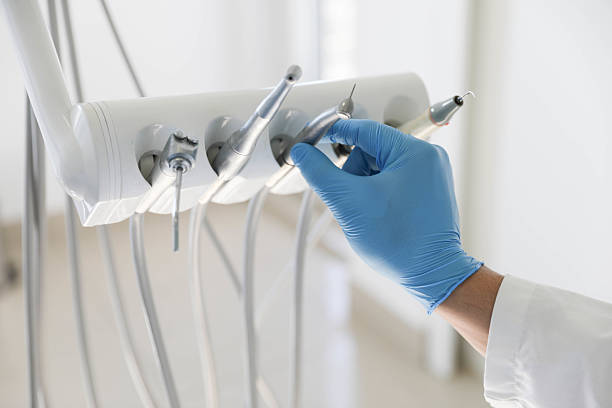 Professional Tooth Extraction technician working in Wellington, FL